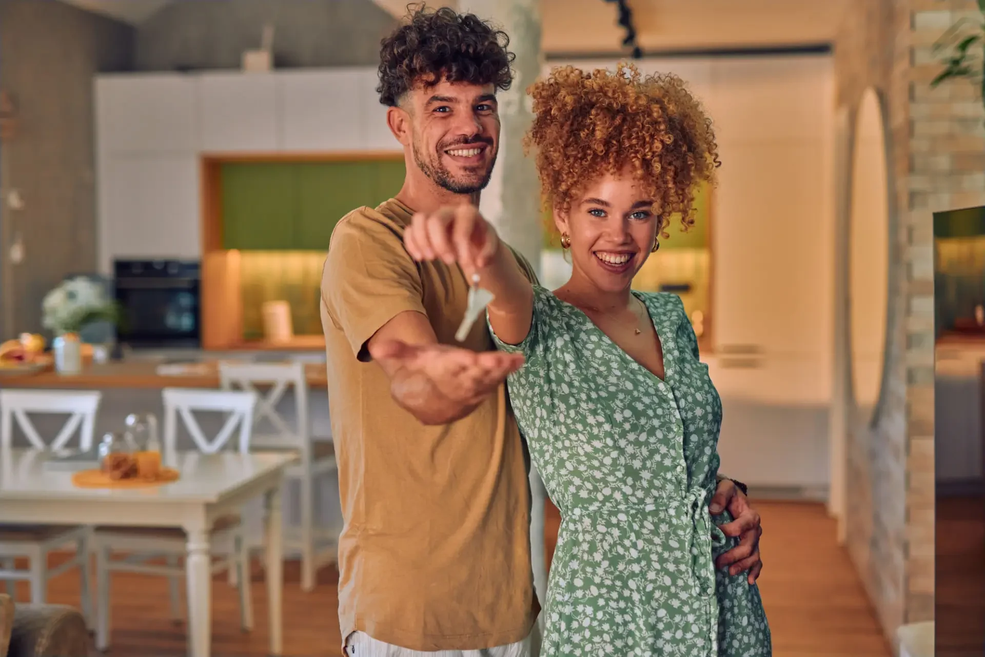 Homebuyers celebrating receiving the keys to their home